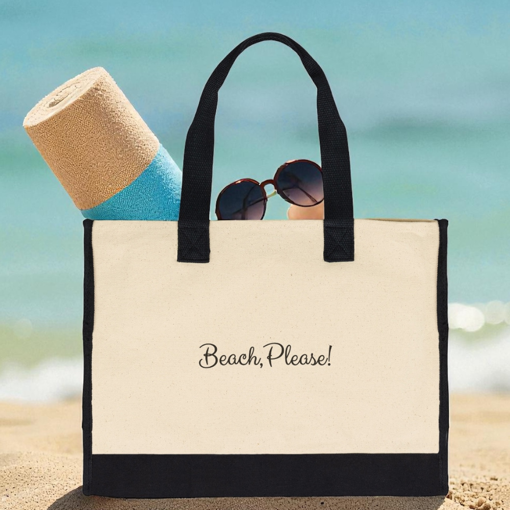 Beach bag with 'Beach, Please!' text on a sandy background