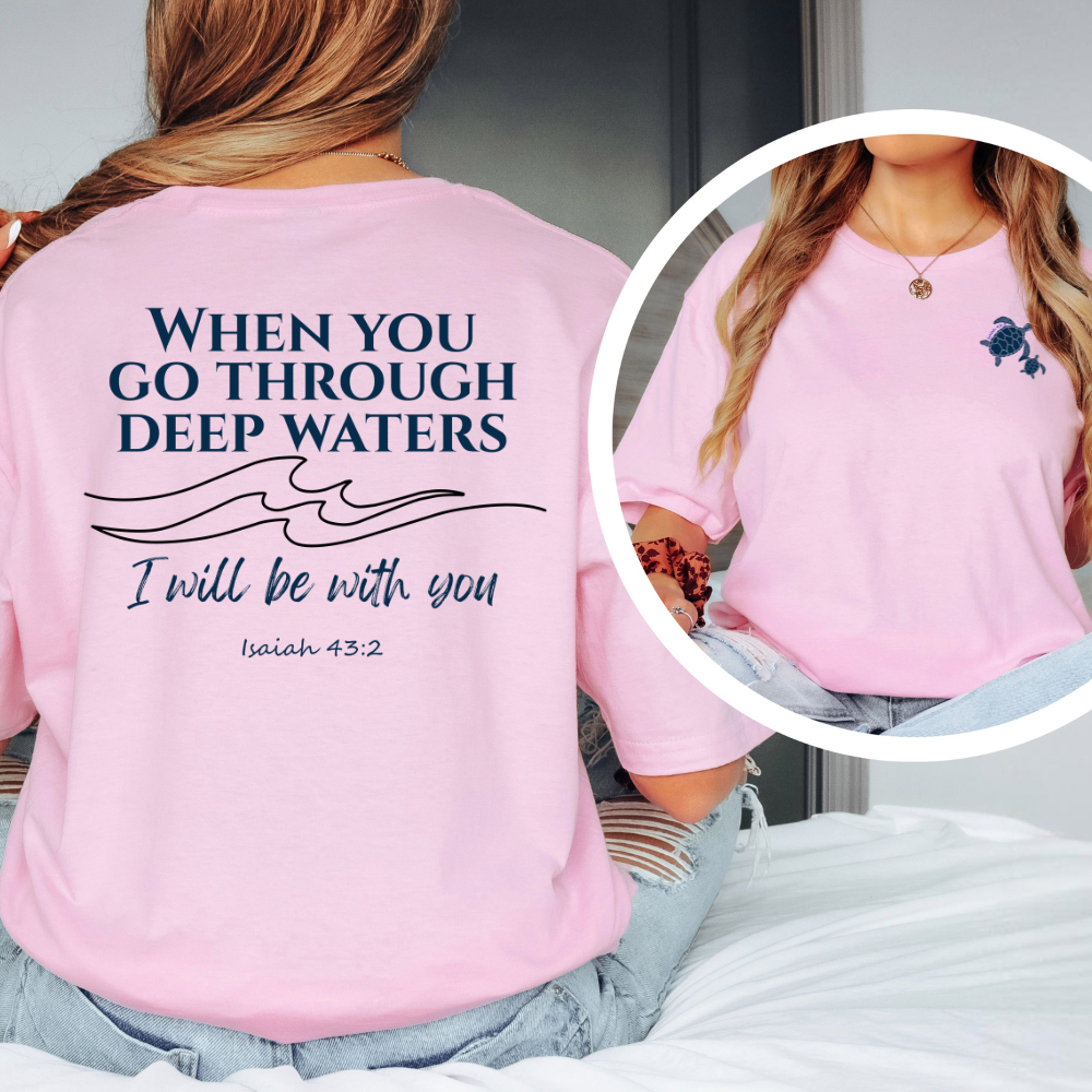 Pink t-shirt with motivational quote on the back, worn by a person.