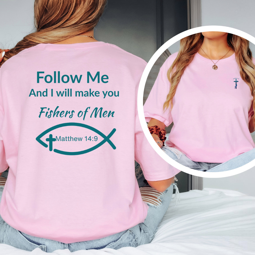 Pink t-shirt with religious text and design on the back, worn by a person.