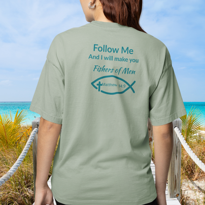 Person wearing a green t-shirt with a religious message on the beach