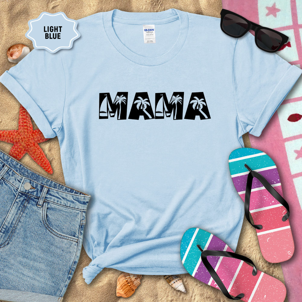 Light blue t-shirt with 'MAMA' text on a sandy background with beach accessories.