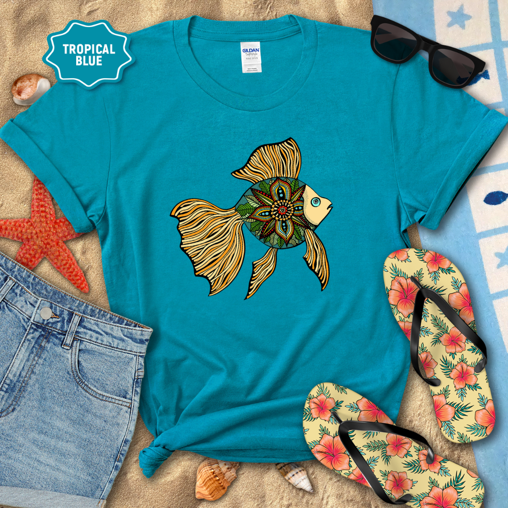 Blue t-shirt with a fish design, sunglasses, flip-flops, and beach items on a sandy background.