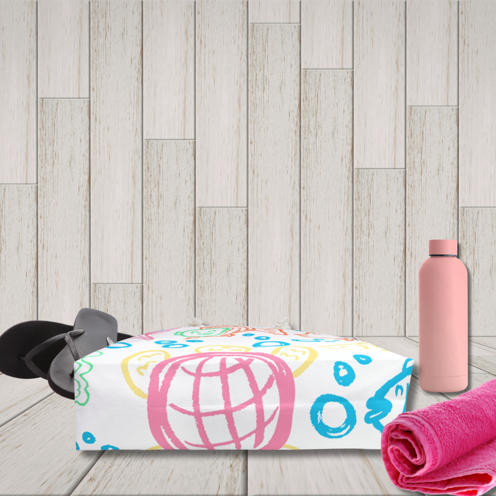 Colorful towel with abstract designs, pink water bottle, and black sandals on a wooden floor.