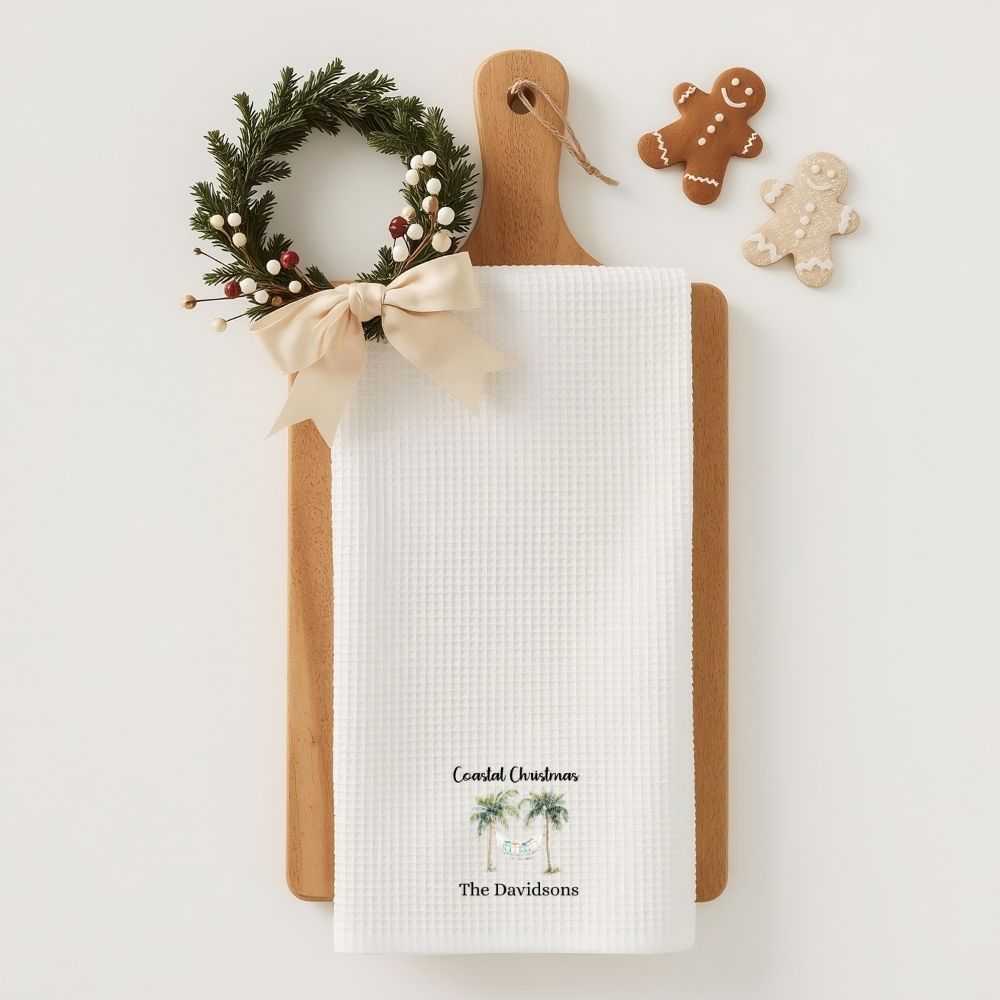 Christmas-themed cutting board with a wreath, bow, and gingerbread cookies on a white background.