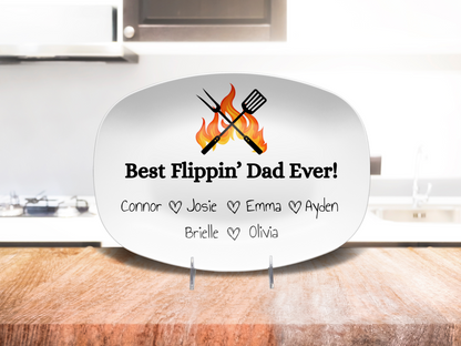 Custom Father’s Day grill plate displayed on a wooden counter top with flame and spatula design
