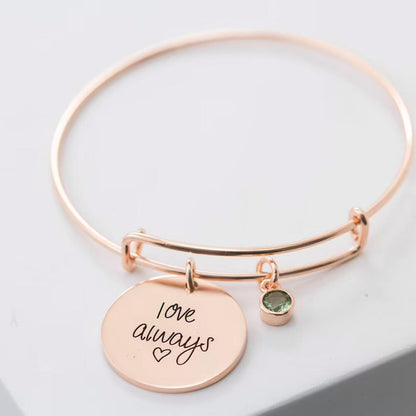 Elegant bangle bracelet with round name charms and birthstone accent