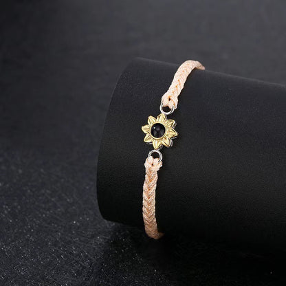 Fashionable and sentimental sunflower projection bracelets on display

