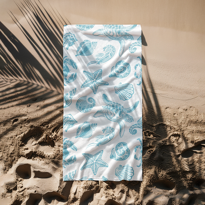Close-up of ocean-themed towel with shells and marine animals in blue