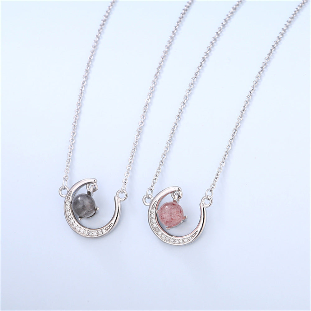 Romantic daughter jewelry gift featuring a silver crescent moon pendant and pink or blue crystal in a keepsake box with loving message.