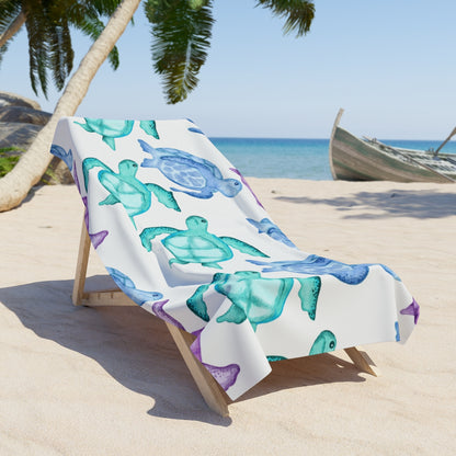 Soft beach towel featuring colorful sea turtles on a white background