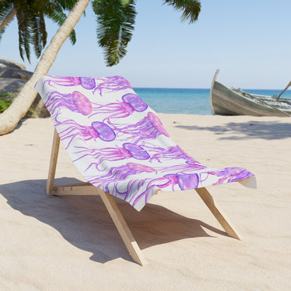 Jellyfish-themed beach towel draped on a lounge chair at the beach