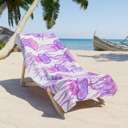 Beach towel with watercolor purple and pink jellyfish on a white background