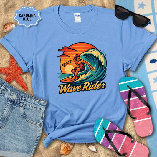 Blue t-shirt with 'Wave Rider' graphic design on a sandy background with beach accessories.