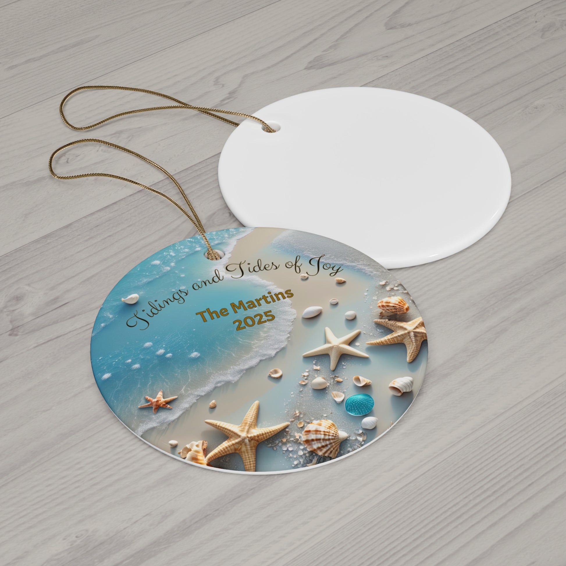 Decorative ornament with beach scene and personalized text on a wooden surface