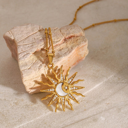 18K gold celestial necklace with sun, moon, and star design