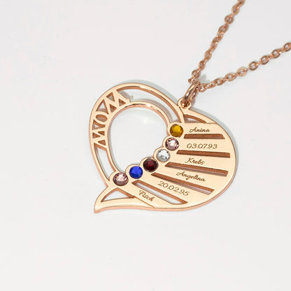 Heart-shaped necklace with engraved names and dates on a light gray background