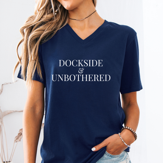 Navy blue t-shirt with 'DOCKSIDE & UNBOthered' text worn by a person.