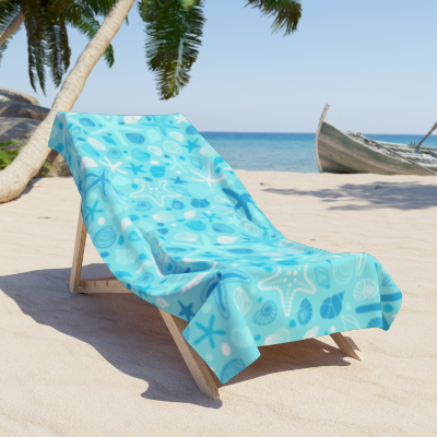 Soft beach towel featuring ocean elements like shells and starfish