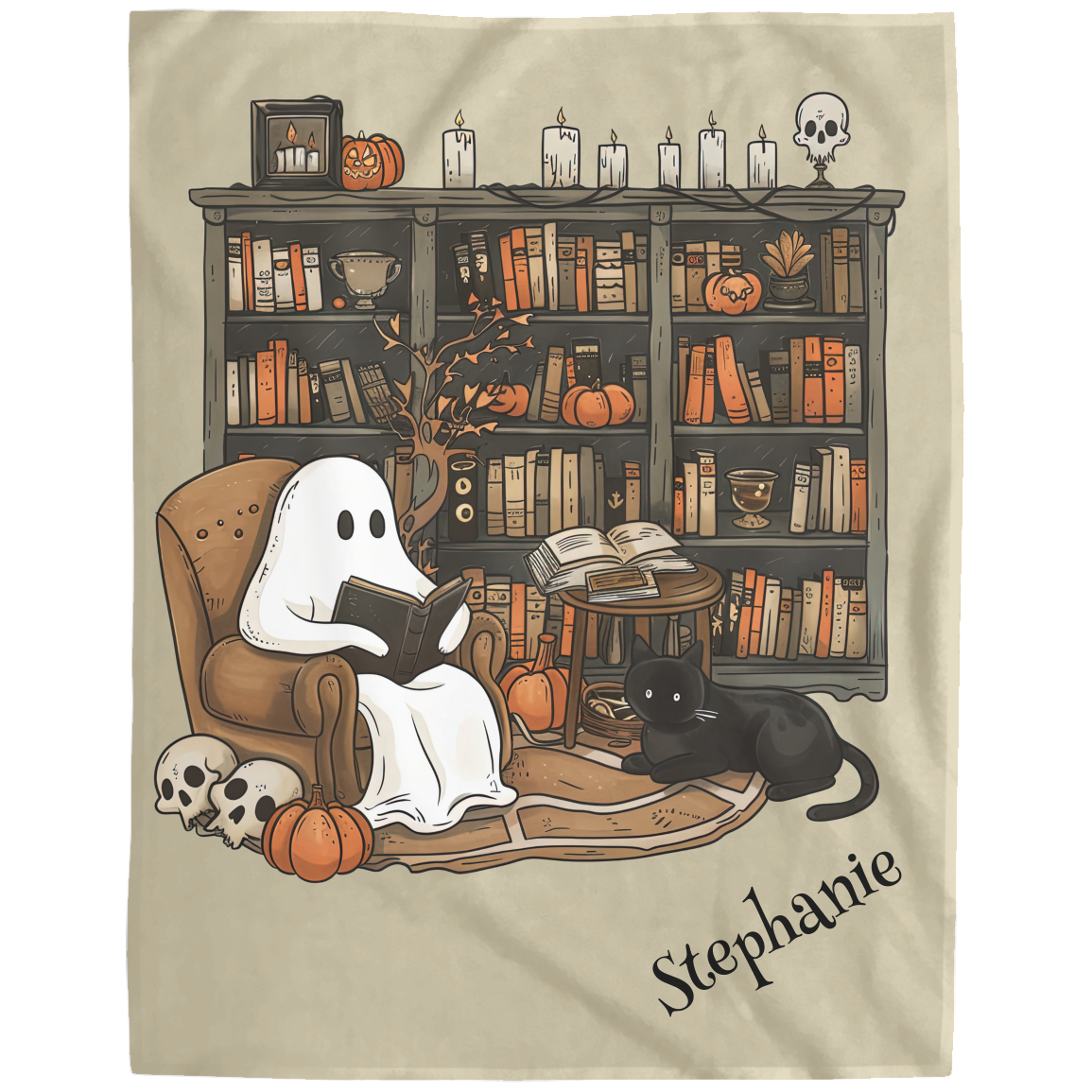 Decorative towel with ghost reading a book, black cat, and Halloween decorations on a bookshelf.