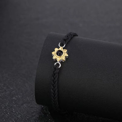 Fashionable and sentimental sunflower projection black bracelets on display 