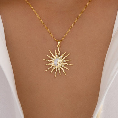 Sunburst necklace resting on stone, showcasing cosmic elegance

