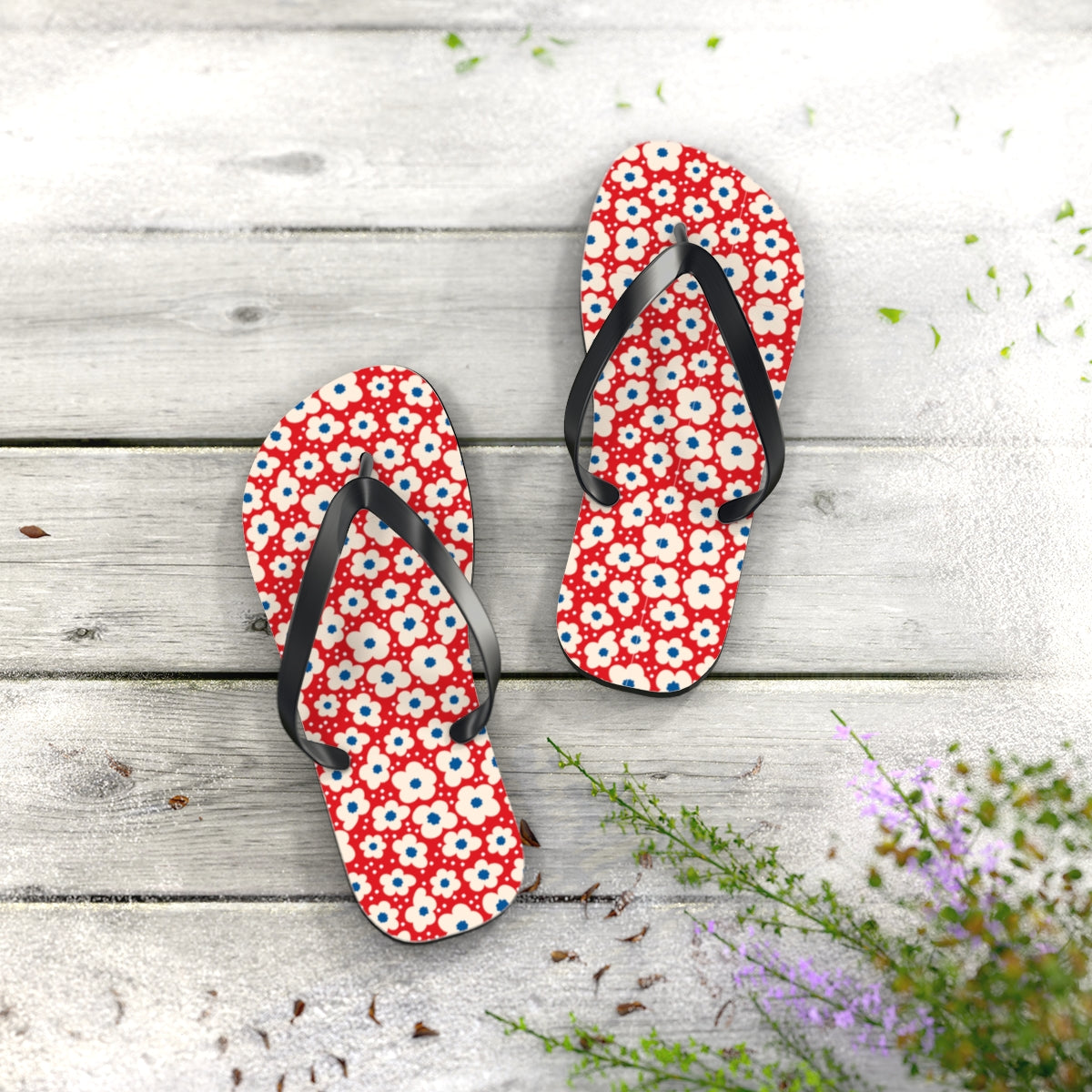 Red flip flops with patriotic floral pattern and black straps
