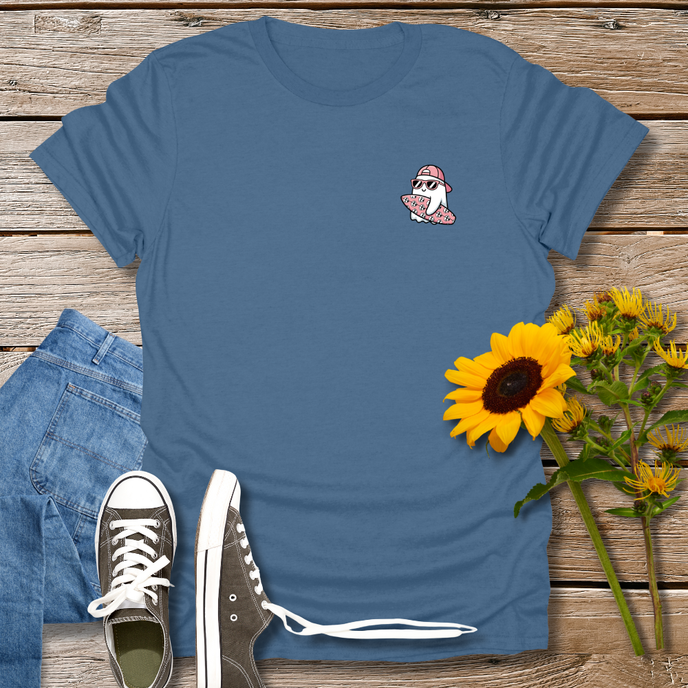 Blue t-shirt with a small graphic, black sneakers, and sunflowers on a wooden surface