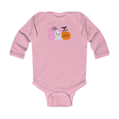 Pink baby onesie with Halloween-themed design on a white background