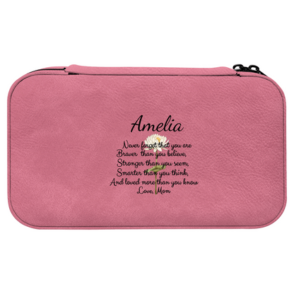 Pink pouch with custom text surrounded by makeup items and accessories