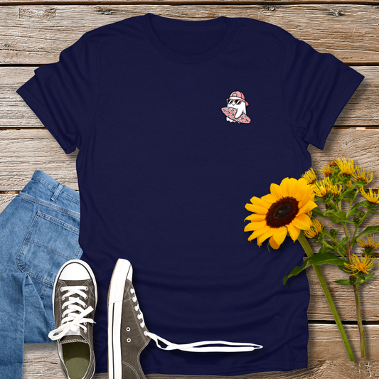 Navy blue t-shirt with a small graphic on a wooden surface with jeans, sneakers, and sunflowers.