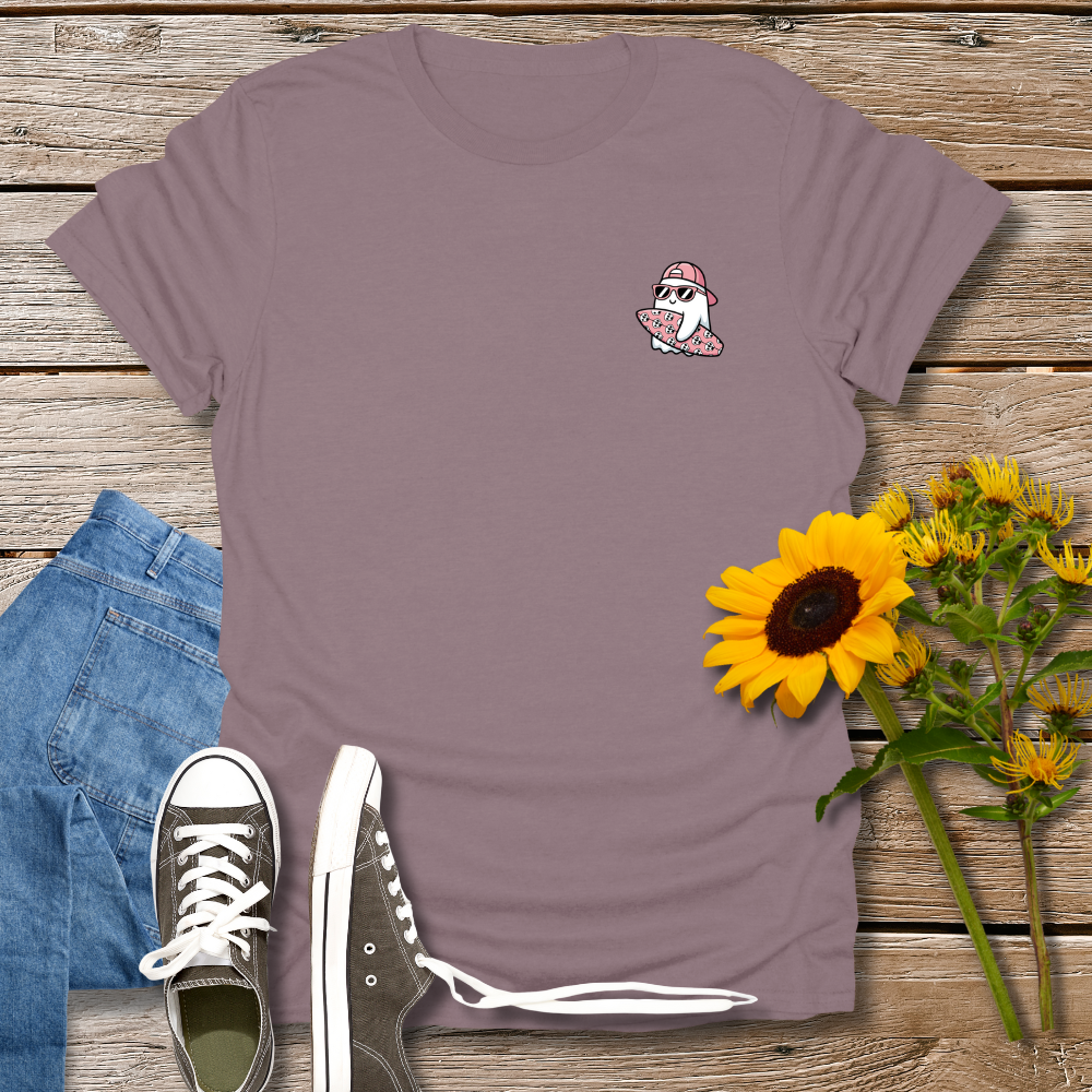 Purple t-shirt with a small graphic, blue jeans, black sneakers, and sunflowers on a wooden surface