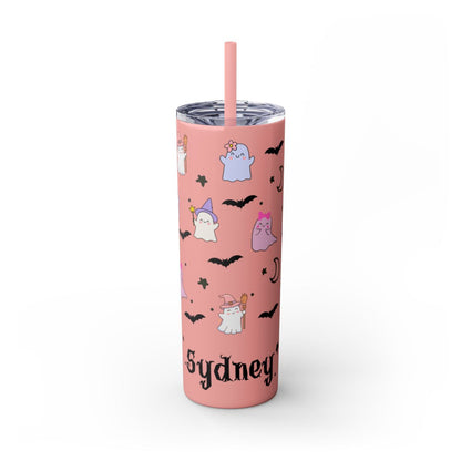 Pink tumbler with Halloween-themed design and straw on a white background