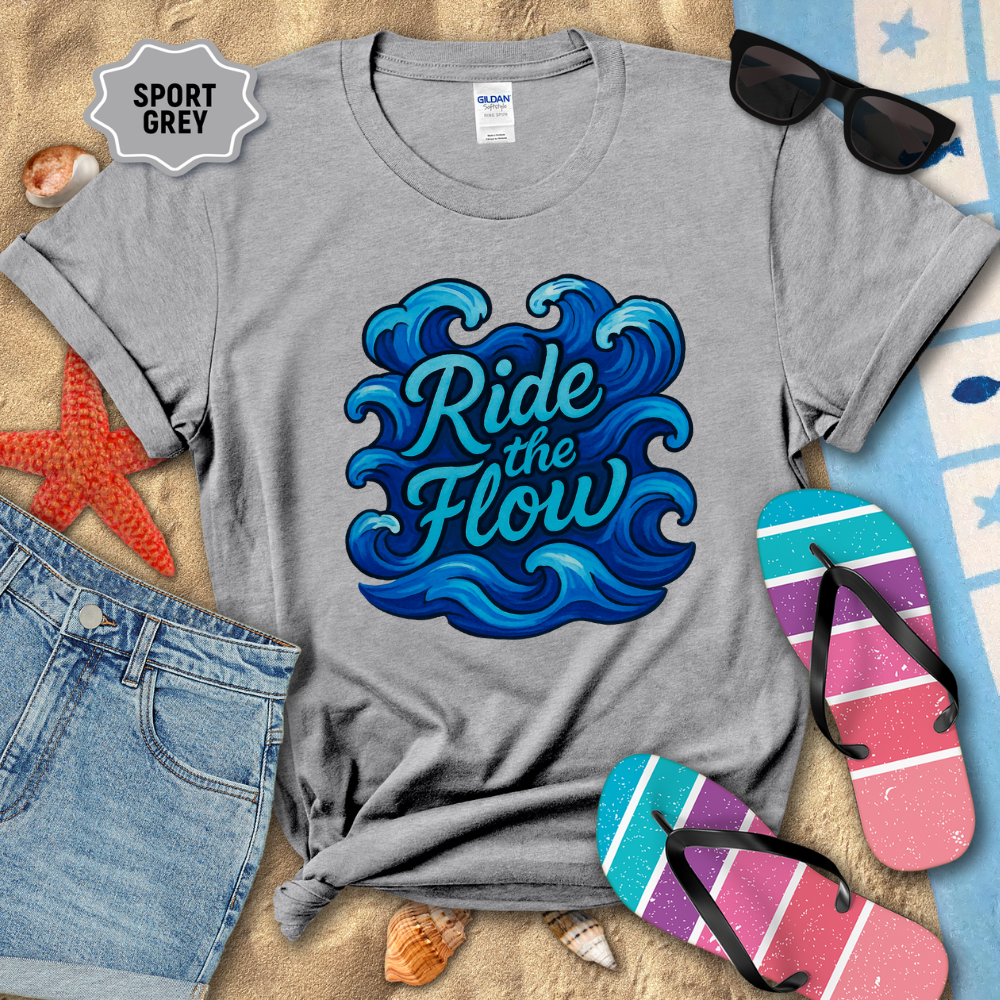 Gray t-shirt with 'Ride the Flow' design on a beach-themed background