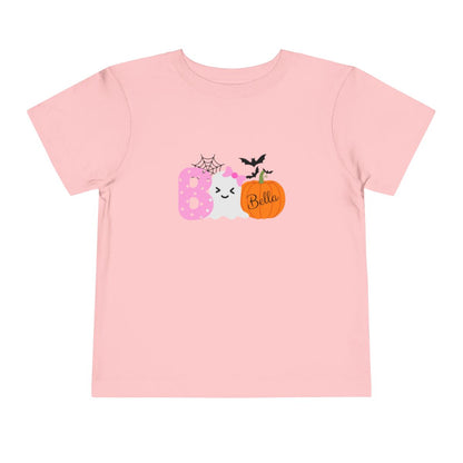 Pink t-shirt with Halloween-themed design and name on a white background