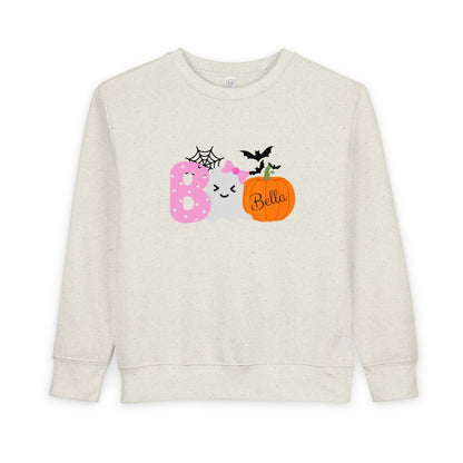 Beige sweatshirt with Halloween-themed design and 'Bella' text on a white background