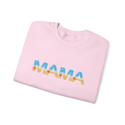 Beach-themed MAMA sweatshirt in warm neutral tones with coastal lettering and playful starfish accents on the arm.

