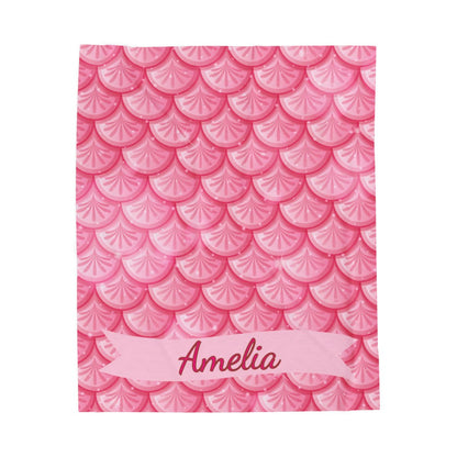 Pink notebook with scallop pattern and 'Amelia' text on a white background