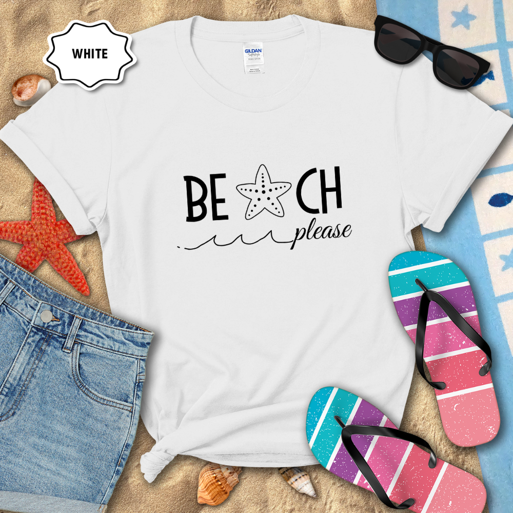 White t-shirt with 'Beach Please' text, sunglasses, and flip-flops on a sandy background