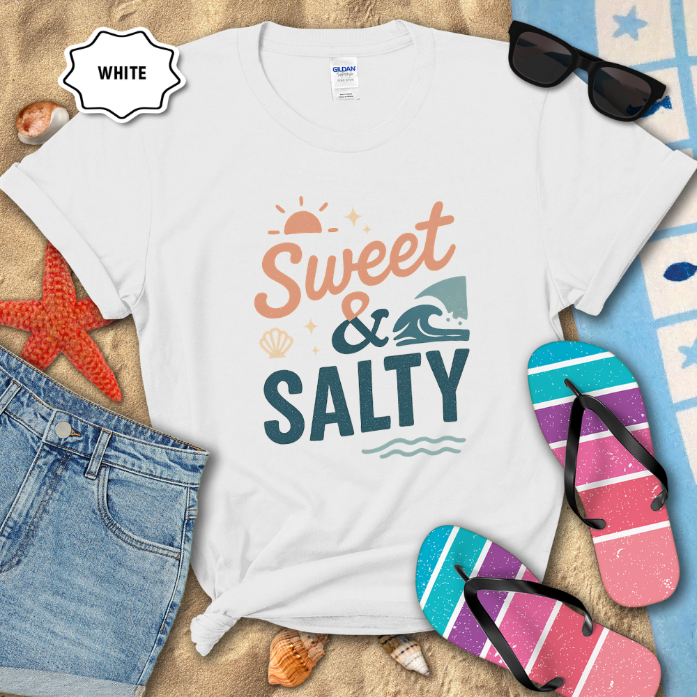 White t-shirt with 'Sweet & Salty' text on a sandy background with flip-flops and sunglasses.
