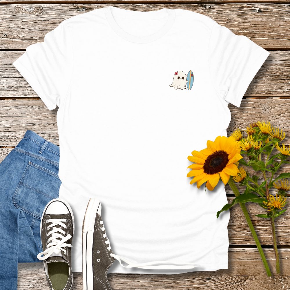 White t-shirt with a ghost graphic, blue jeans, gray sneakers, and sunflowers on a wooden surface